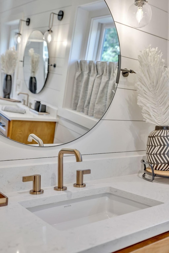 bathroom featuring vanity with extensive cabinet space