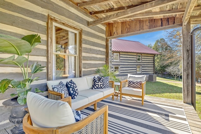 sunroom / solarium featuring wooden ceiling and beam ceiling