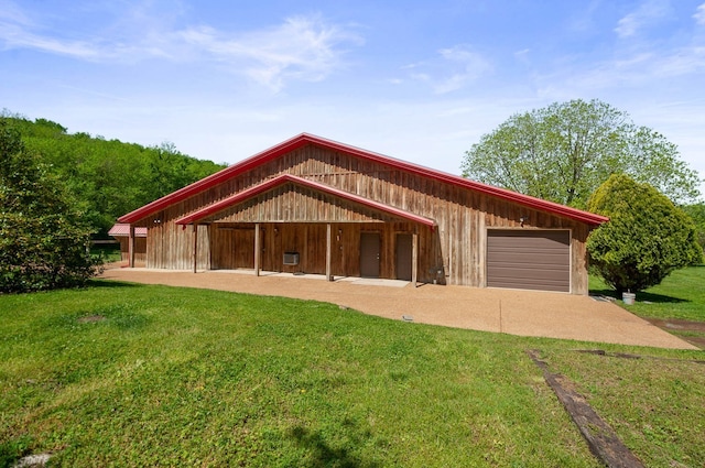 garage with a yard