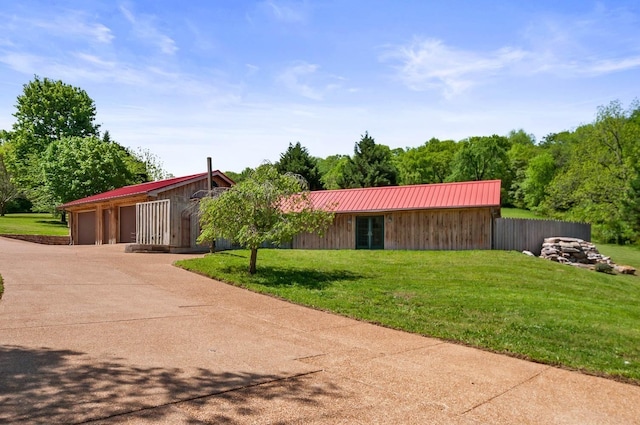 ranch-style home with a garage and a front lawn