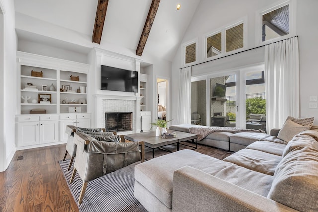 living room with dark hardwood / wood-style flooring, a fireplace, high vaulted ceiling, and beamed ceiling