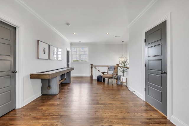 entrance foyer with dark hardwood / wood-style flooring and ornamental molding