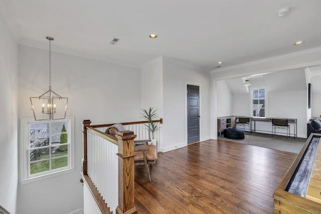 interior space with a notable chandelier, dark hardwood / wood-style floors, and crown molding