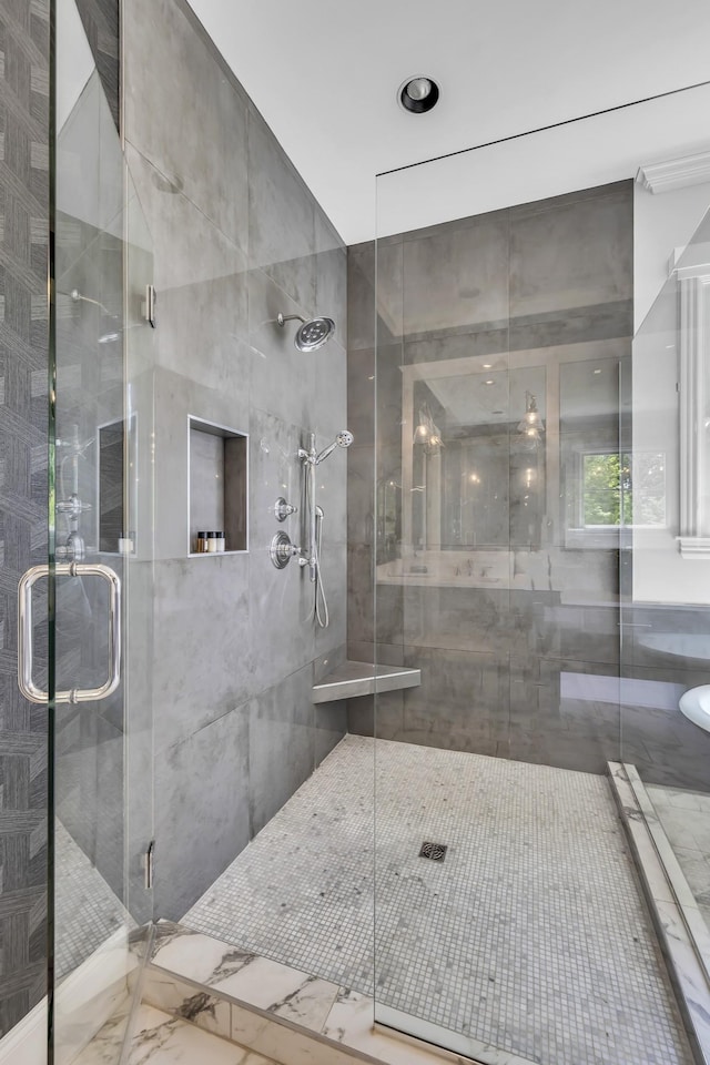 bathroom with a shower with shower door