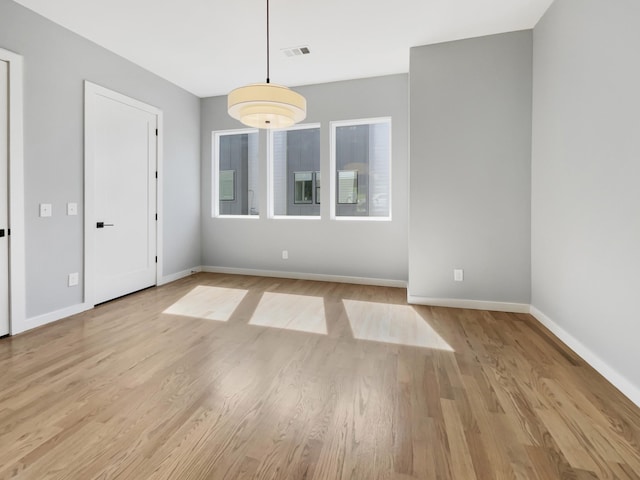 spare room featuring light hardwood / wood-style floors