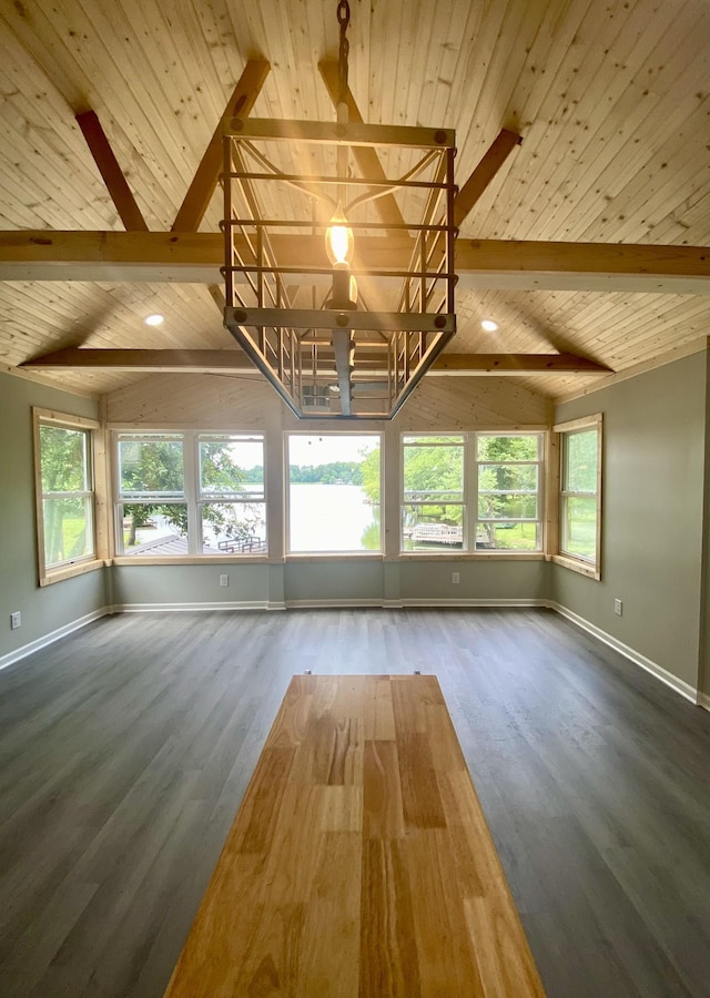 interior space featuring wood-type flooring, vaulted ceiling with beams, and a healthy amount of sunlight