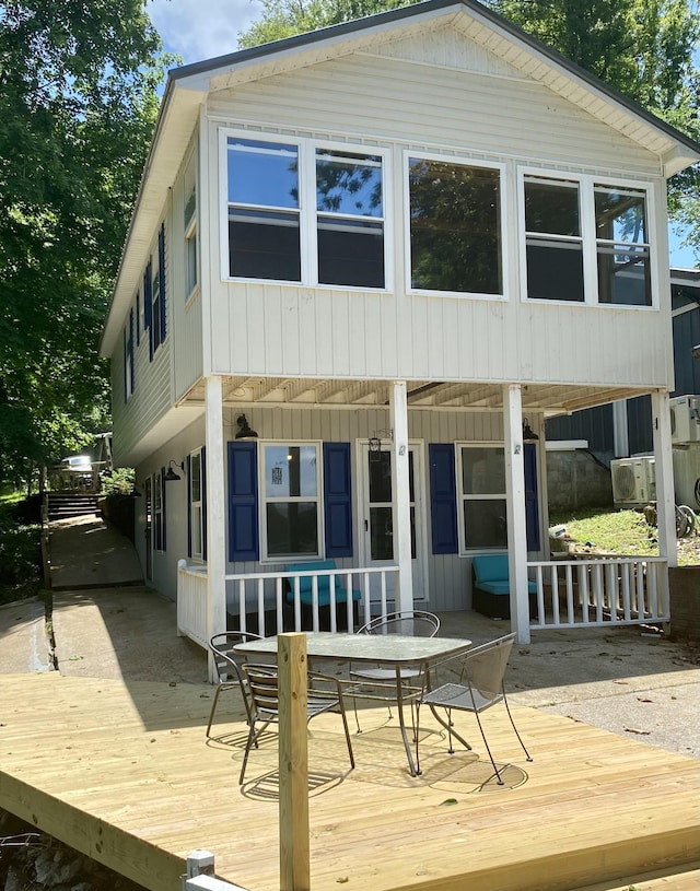 rear view of house with a wooden deck