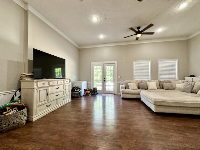 living room featuring ceiling fan, ornamental molding, french doors, and dark hardwood / wood-style floors