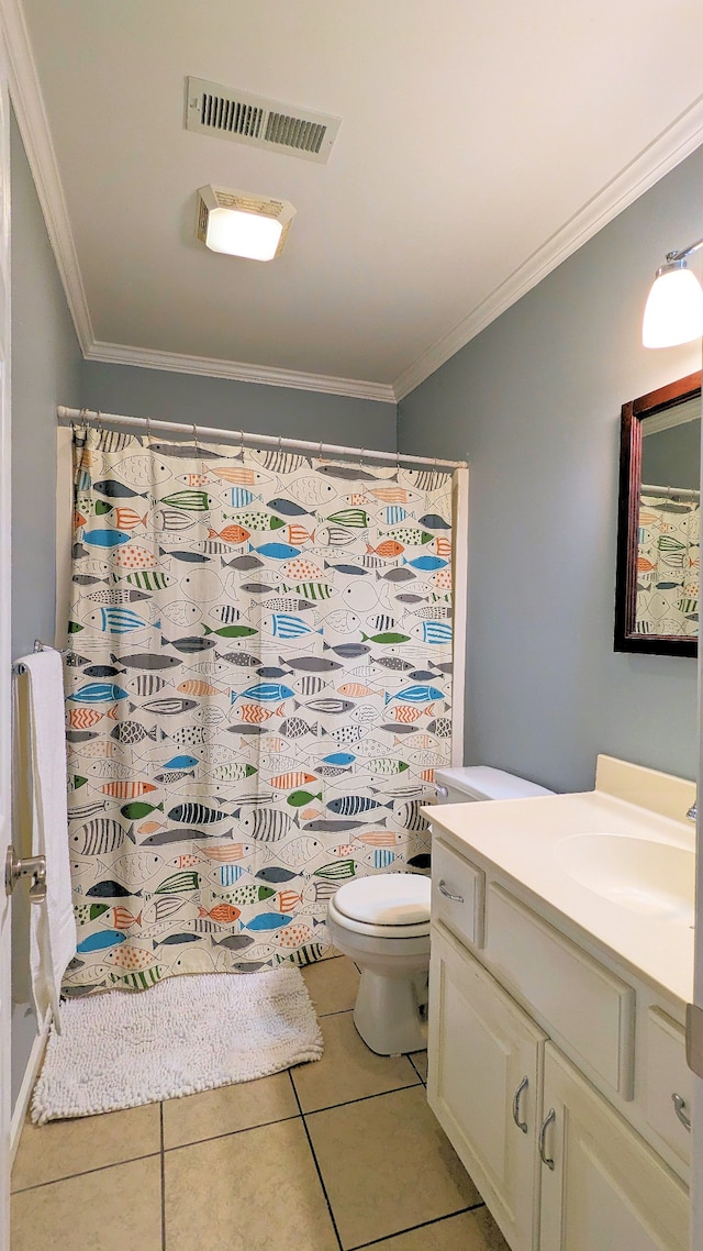 bathroom featuring tile floors, crown molding, toilet, and vanity