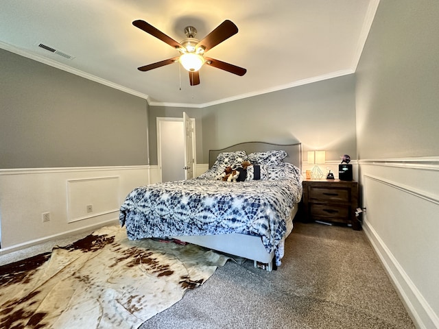 bedroom featuring carpet flooring, ceiling fan, and crown molding