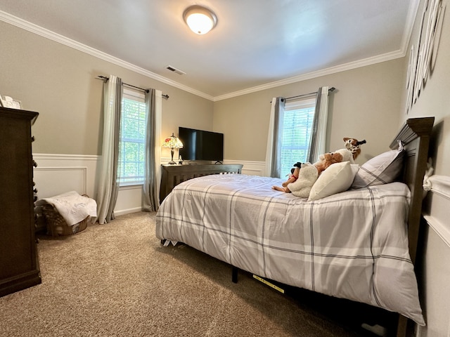 bedroom featuring crown molding and carpet flooring