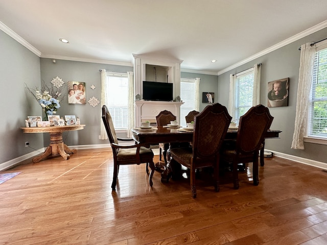 dining room featuring hardwood / wood-style floors and ornamental molding