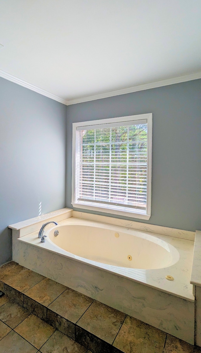 bathroom featuring tile flooring, a bath, and crown molding