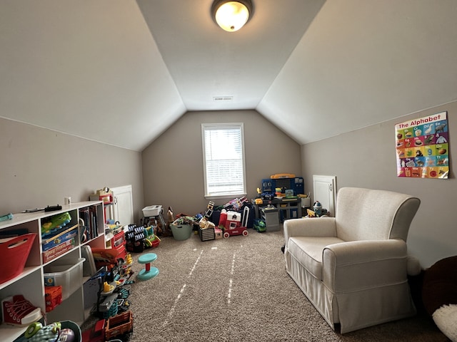 rec room featuring carpet flooring and vaulted ceiling