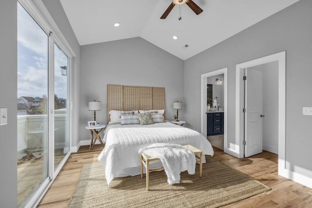 bedroom with ceiling fan, vaulted ceiling, light hardwood / wood-style flooring, and ensuite bathroom