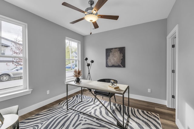 office area featuring dark wood-type flooring and ceiling fan