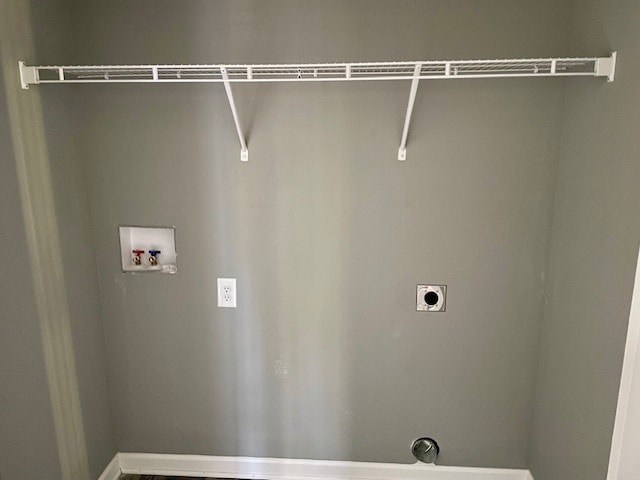 washroom with hookup for a washing machine and hookup for an electric dryer