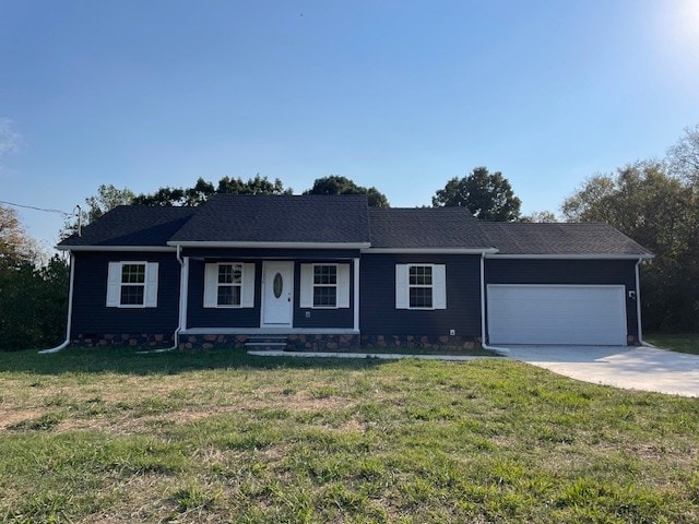 single story home featuring a porch, a front yard, and a garage