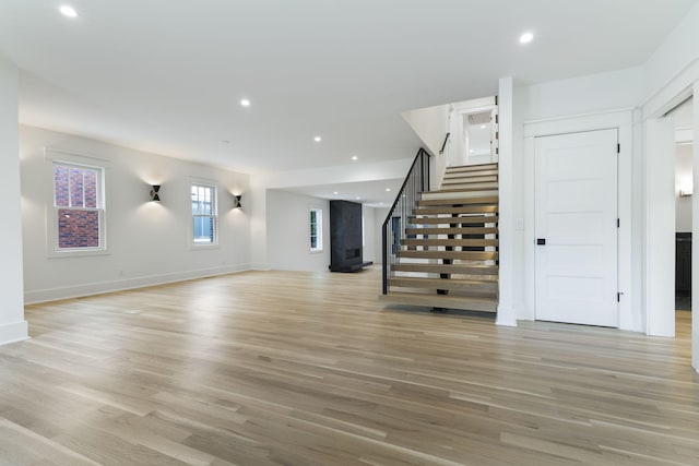 unfurnished living room featuring light hardwood / wood-style flooring