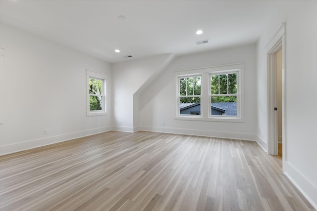 bonus room with light hardwood / wood-style flooring