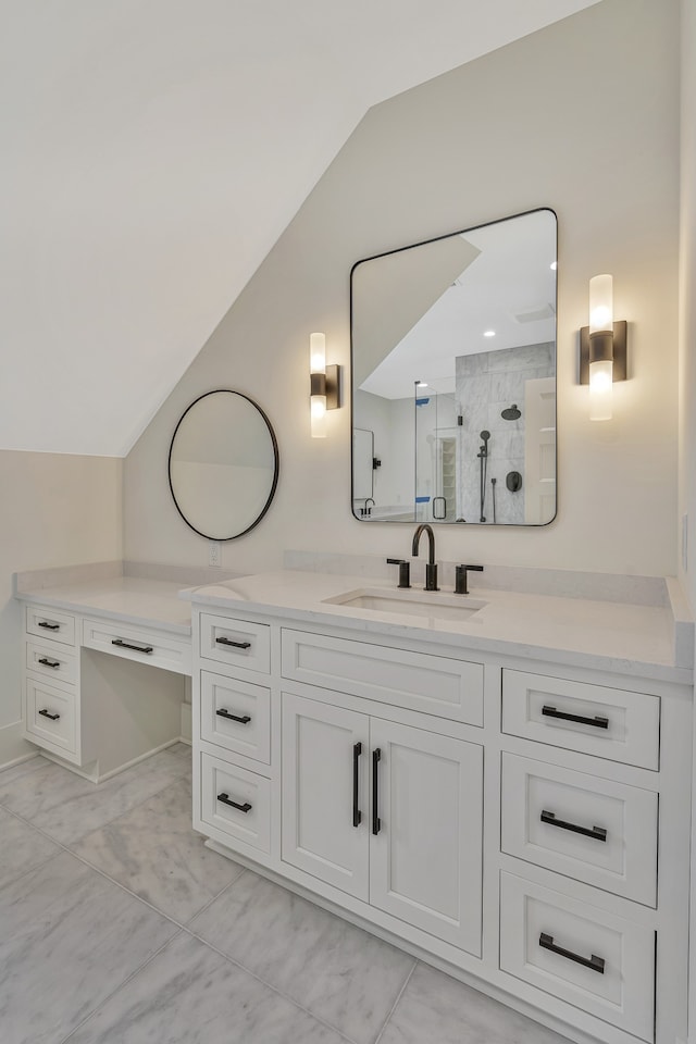 bathroom featuring lofted ceiling, vanity, and walk in shower