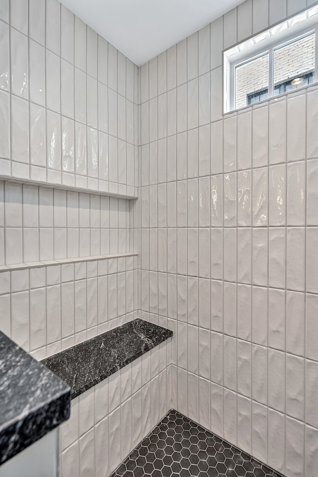 bathroom with tile walls