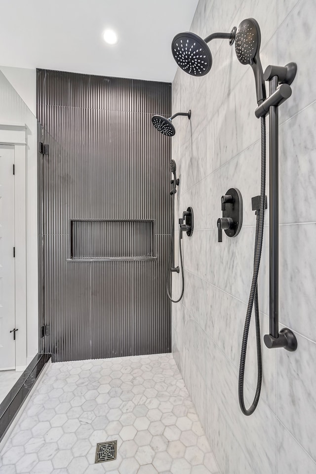 bathroom with a tile shower