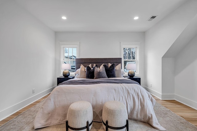 bedroom with hardwood / wood-style floors