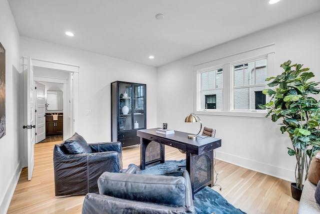 office with light hardwood / wood-style flooring