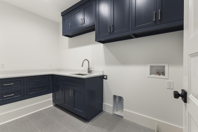 clothes washing area with sink, cabinets, light tile patterned floors, hookup for a washing machine, and hookup for an electric dryer