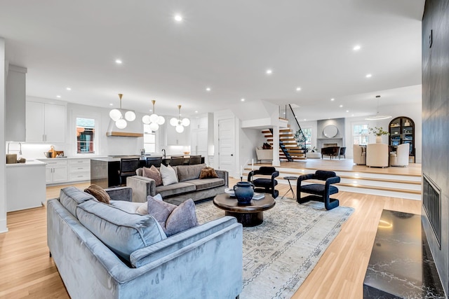 living room with plenty of natural light and light hardwood / wood-style floors