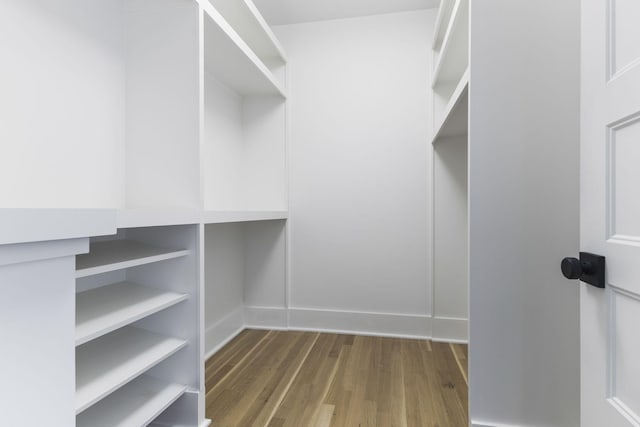 walk in closet featuring hardwood / wood-style floors