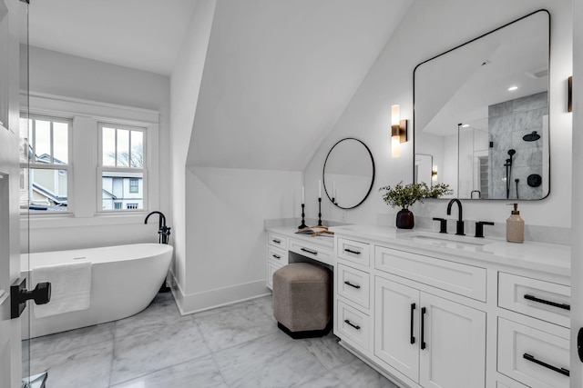 bathroom featuring lofted ceiling, vanity, and separate shower and tub