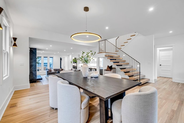 dining area with light wood-type flooring