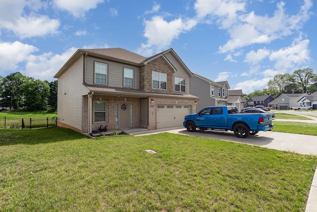 view of front of property with a garage and a front lawn