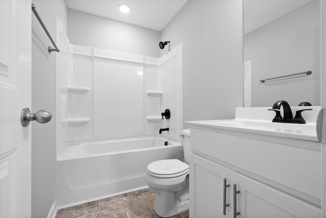 full bathroom with vanity,  shower combination, toilet, and tile patterned flooring