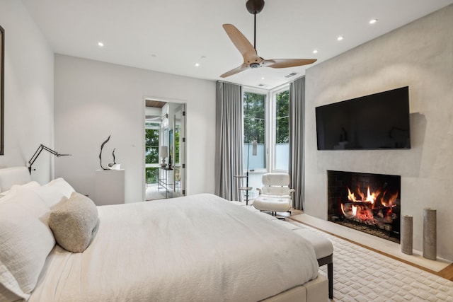 bedroom with hardwood / wood-style floors and ceiling fan