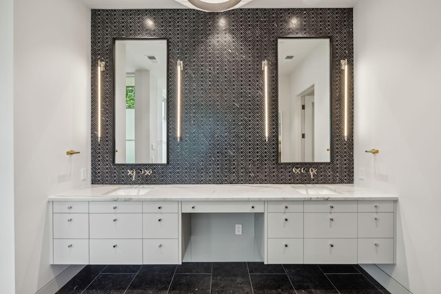 bathroom featuring decorative backsplash, vanity, and tile walls