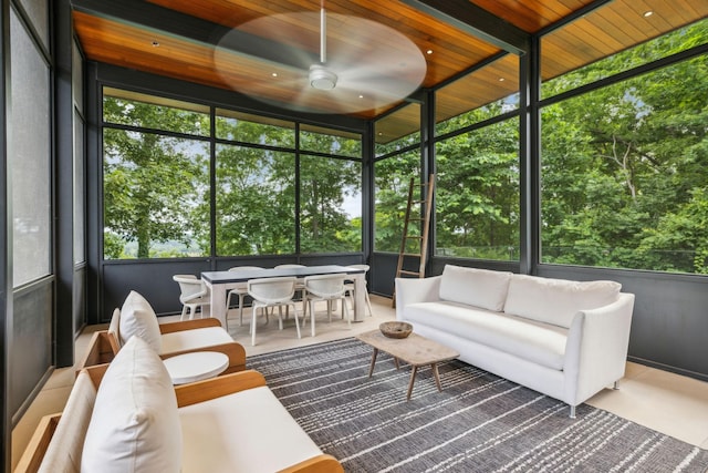 sunroom / solarium with wood ceiling and ceiling fan