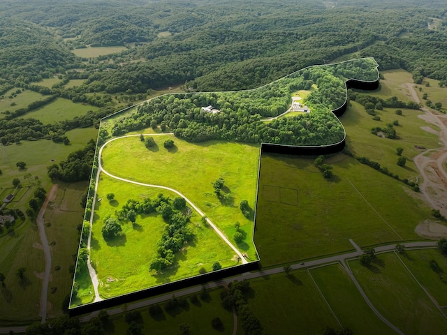 drone / aerial view with a rural view and a water view