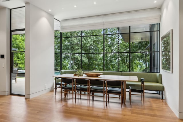 dining area featuring a wealth of natural light and light hardwood / wood-style floors