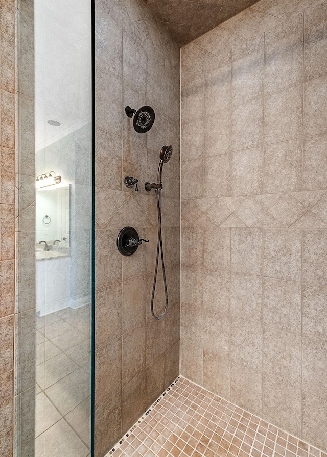 bathroom with tiled shower