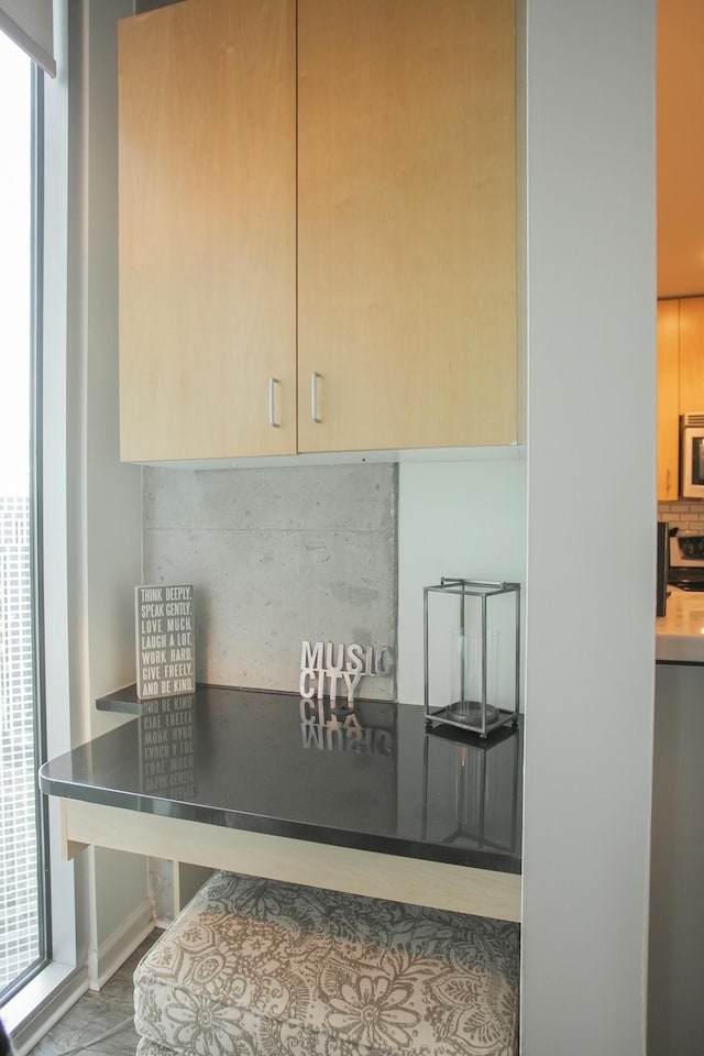 room details featuring decorative backsplash and range