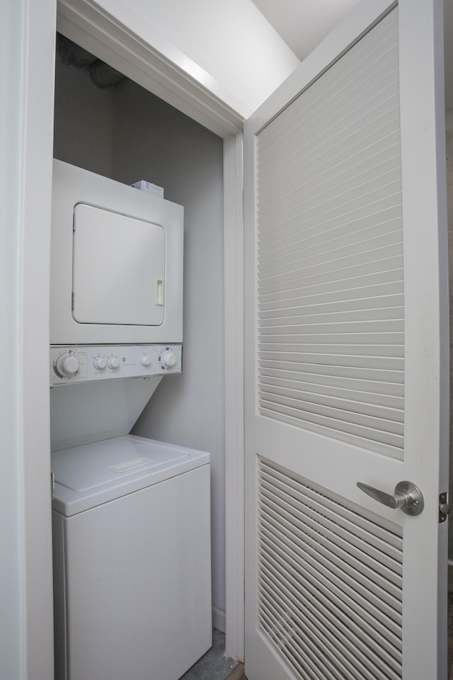 laundry room featuring stacked washer and clothes dryer