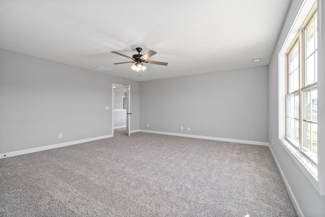 unfurnished room with carpet flooring and ceiling fan