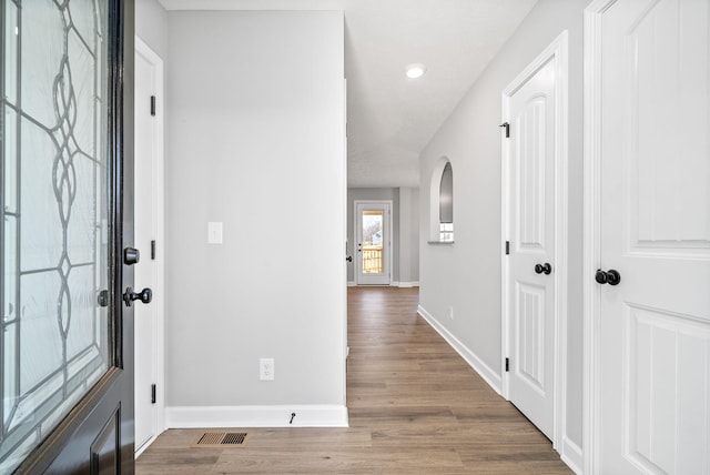 foyer entrance featuring hardwood / wood-style flooring