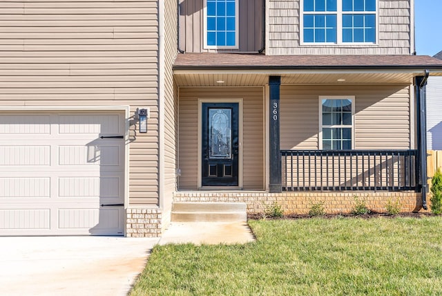 view of exterior entry featuring covered porch