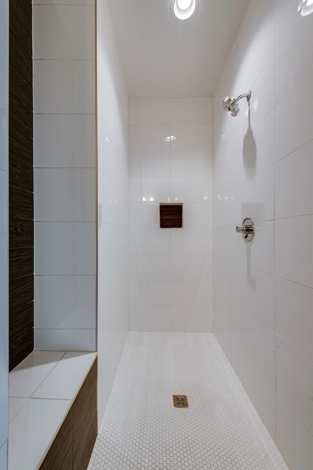 bathroom with tiled shower