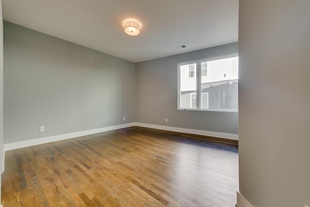 empty room featuring wood-type flooring