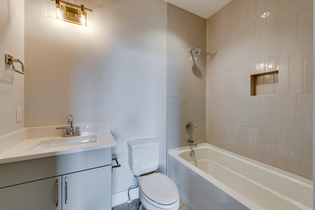 full bathroom with vanity, toilet, and tiled shower / bath